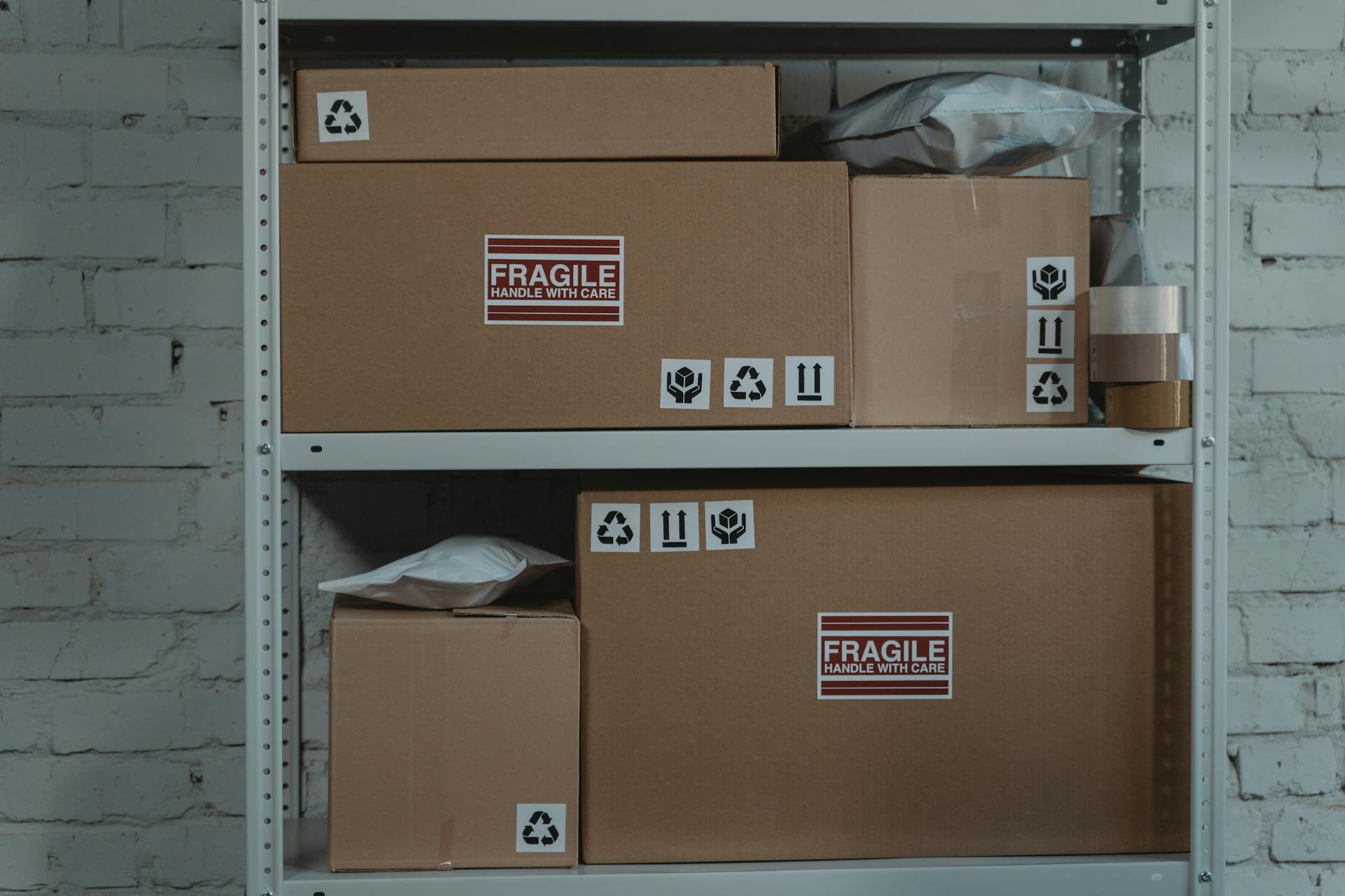 Workers drive Forklifts laden with USAID goods inside a large warehouse - 20110826-FS-LSC-0425 - Flickr - USDAgov